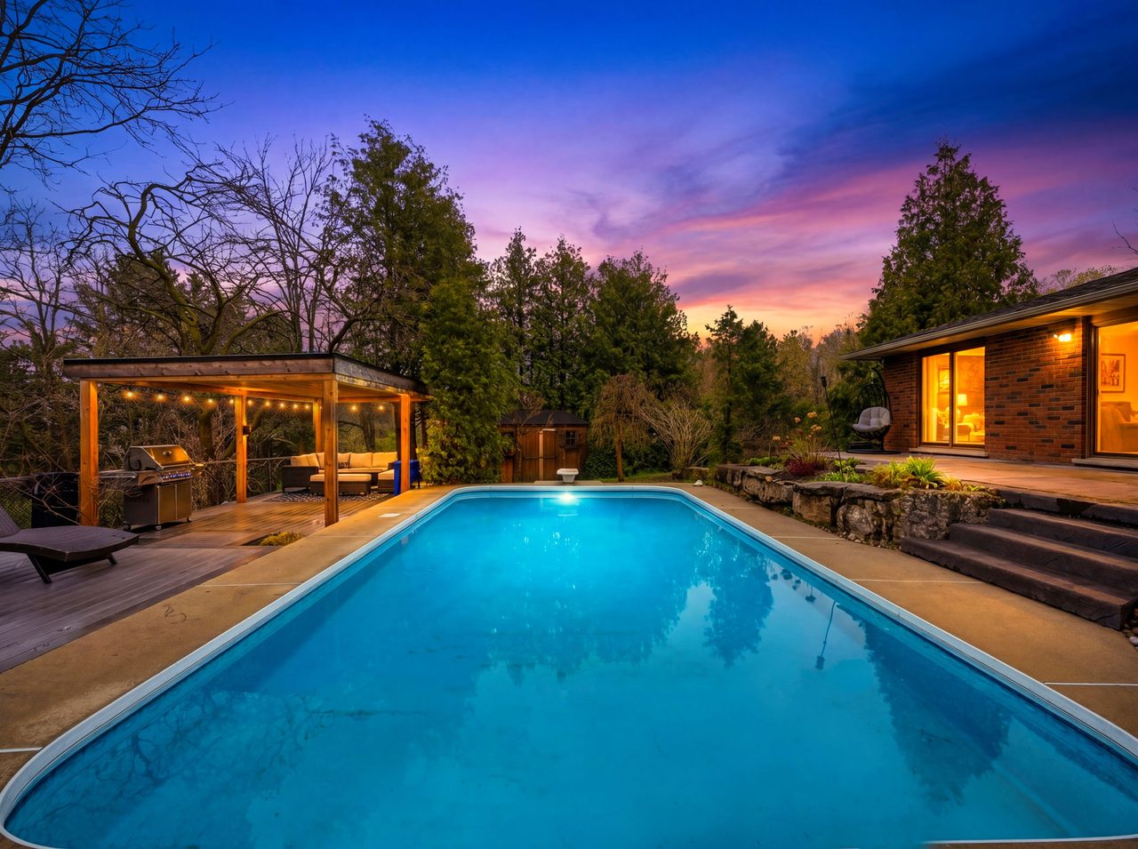 Backyard pool at twilight